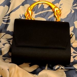 Woman's vintage Black cocktail purse with Gold Jaguar handle.